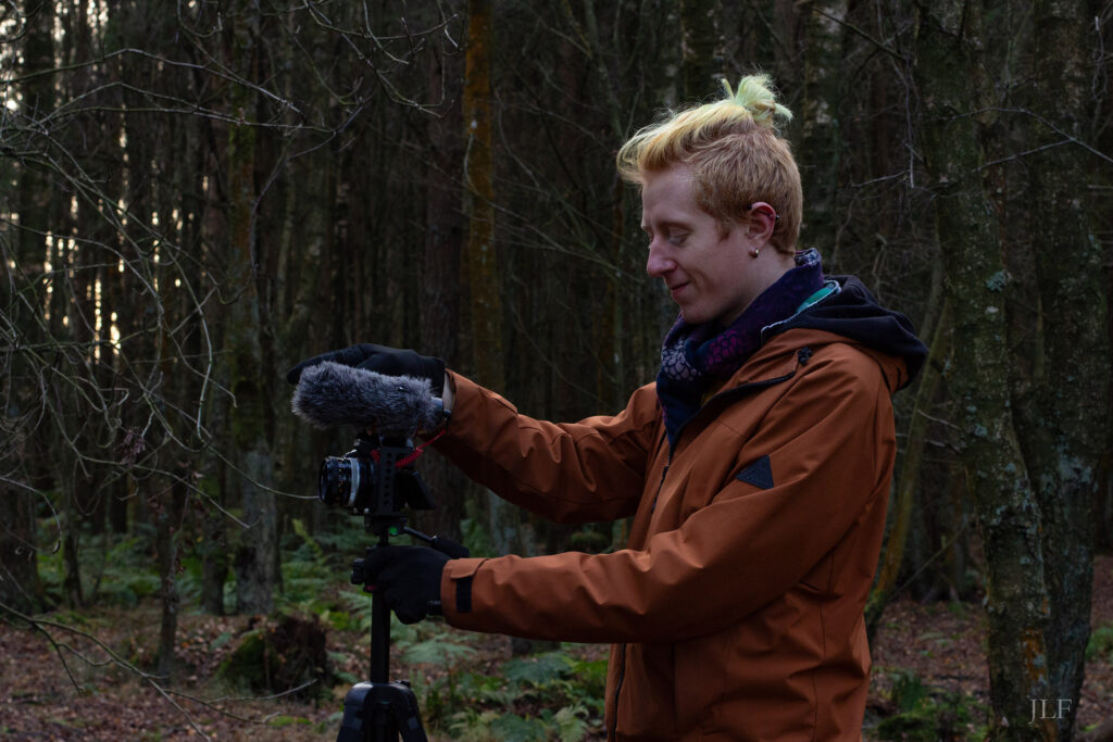 Mitchell filming in the woods. Autumn, sunset.